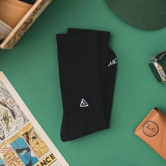 A close up to a pair of black socks