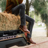 Men siting on a Ranger wearing steel toe Wallace boots,