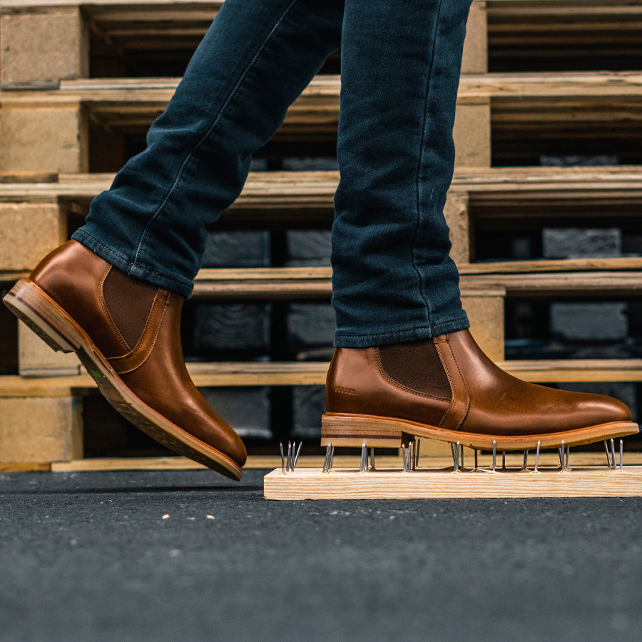 Puncture resistant Wallace boots standing on nails