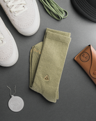 Close up to a pair of mineral green socks